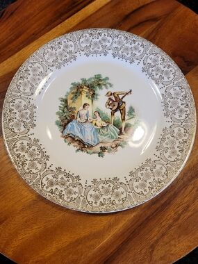 Triumph Porcelain Dinner Plate in White with Gold and Pastel Scene